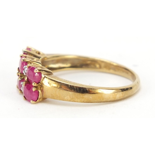 324 - 9ct gold ruby and diamond two row ring, size P, 2.4g