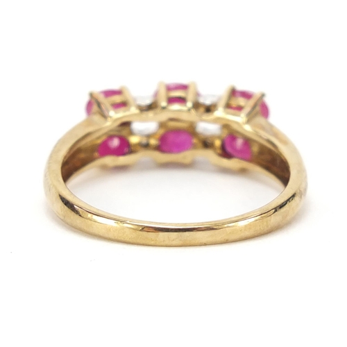 324 - 9ct gold ruby and diamond two row ring, size P, 2.4g