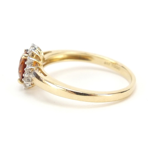 698 - 9ct gold citrine and diamond cluster ring, size P, 2.6g