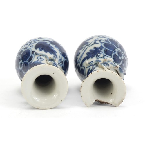 1139 - Pair of Chinese blue and white porcelain vases with relief dragons, each hand painted with flowers, ... 