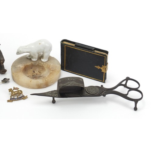 1257 - Objects including a tooled leather notepad, Georgian silver sugar tongs and a carved coquilla nut