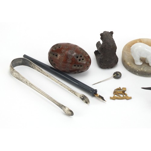 1257 - Objects including a tooled leather notepad, Georgian silver sugar tongs and a carved coquilla nut