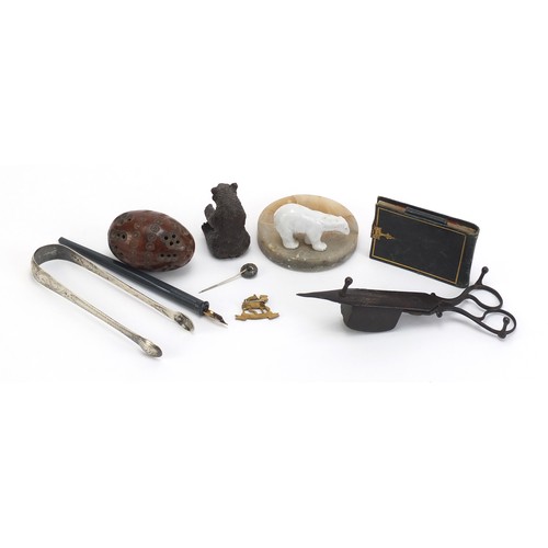 1257 - Objects including a tooled leather notepad, Georgian silver sugar tongs and a carved coquilla nut