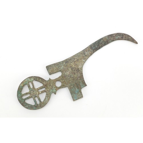 520 - Persian patinated bronze archaic style axe head, 24cm wide