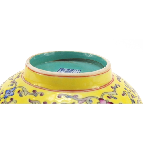 451 - Chinese yellow ground porcelain bowl hand painted in the famille rose palette with blossoming flower... 