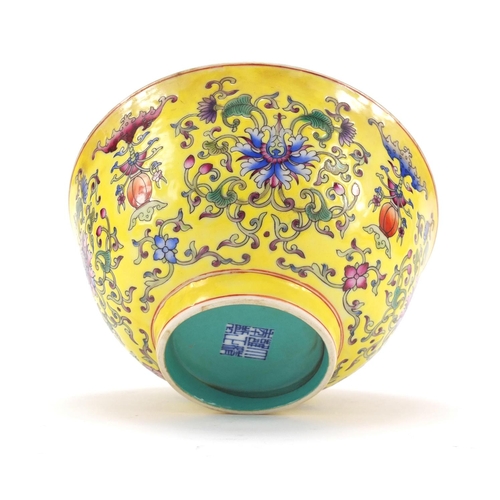 451 - Chinese yellow ground porcelain bowl hand painted in the famille rose palette with blossoming flower... 