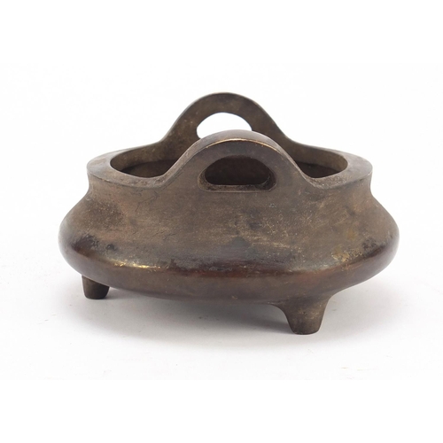 457 - Chinese patinated bronze tripod incense burner, character marks to the base, 14cm in diameter