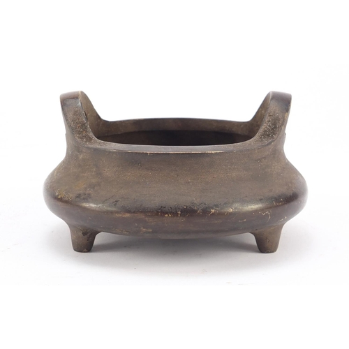 457 - Chinese patinated bronze tripod incense burner, character marks to the base, 14cm in diameter