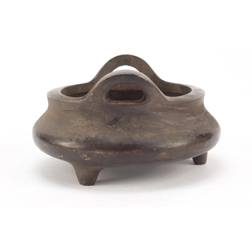 457 - Chinese patinated bronze tripod incense burner, character marks to the base, 14cm in diameter