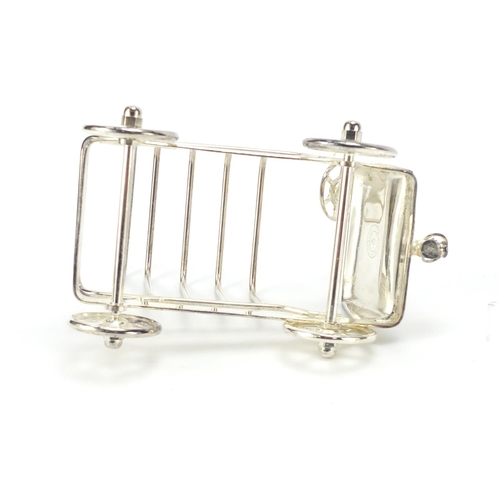 277 - Novelty silver plated toast rack in the form of a car, 16cm in length