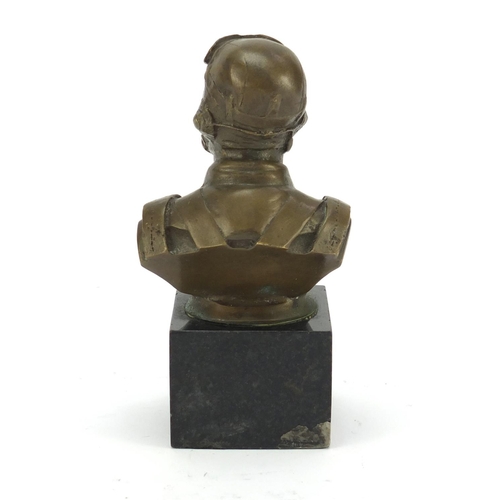 212 - Bronze bust of a World War I Pilot raised on a square black marble base, 13cm high