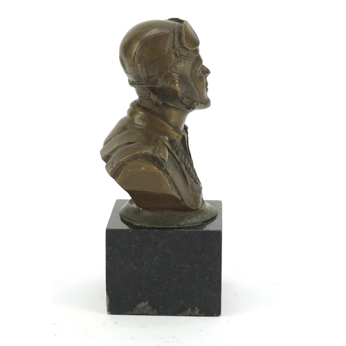 212 - Bronze bust of a World War I Pilot raised on a square black marble base, 13cm high