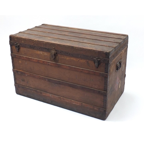 2060 - Early Louis Vuitton wooden and metal bound steamer/travelling trunk with twin handles, paper label t... 