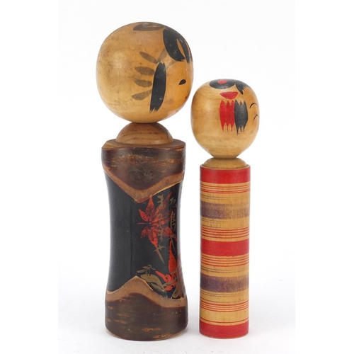 525 - Two Japanese painted wood Kockeshi dolls, the largest 24cm high