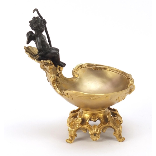 289 - Partially gilt bronze sweetmeat dish in the form of Putti seated on a shell above a bowl, impressed ... 