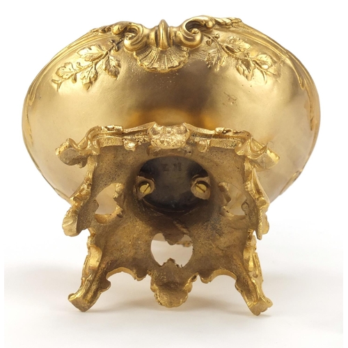 289 - Partially gilt bronze sweetmeat dish in the form of Putti seated on a shell above a bowl, impressed ... 