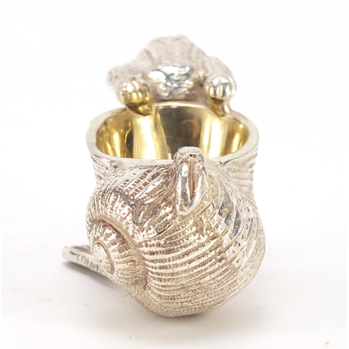 420 - Novelty silver plated salt with gilt interior in the form of a frog pulling a snail shell, 10cm in l... 