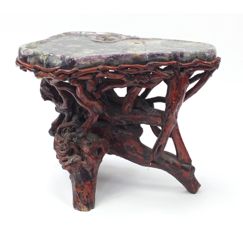 152 - Chinese fluorite specimen tea table raised on a gnarled root base, 57cm H x 74cm W x 50cm D