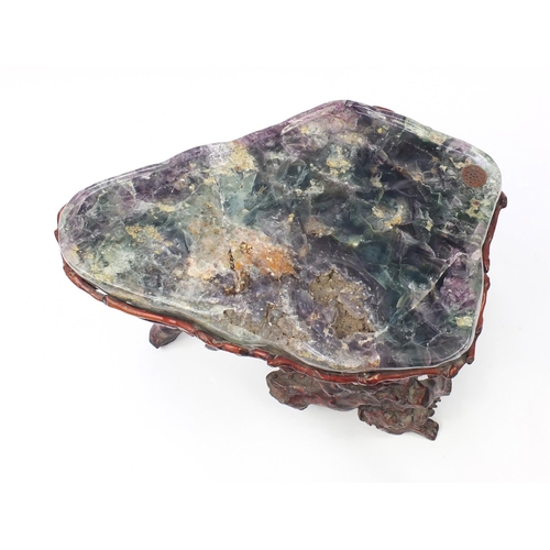 152 - Chinese fluorite specimen tea table raised on a gnarled root base, 57cm H x 74cm W x 50cm D