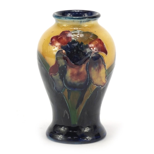 124 - William Moorcroft pottery baluster vase hand painted in the freesia pattern, 10.5cm high