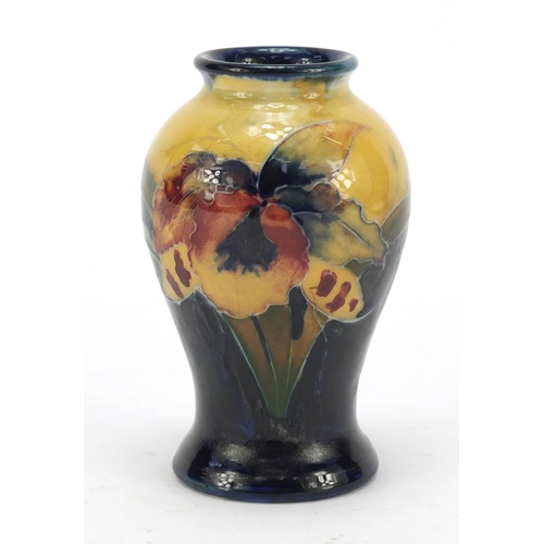124 - William Moorcroft pottery baluster vase hand painted in the freesia pattern, 10.5cm high