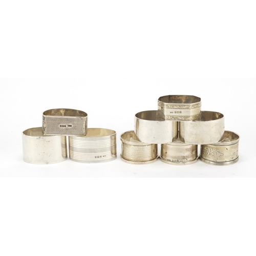 417 - Nine silver napkin rings, various hallmarks, 265g