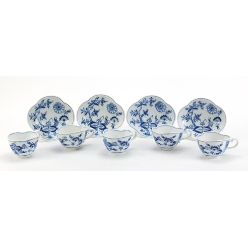 91 - Five Meissen demitasse cups and four saucers, each hand painted in the Blue Onion pattern, crossed s... 