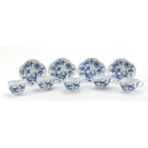 91 - Five Meissen demitasse cups and four saucers, each hand painted in the Blue Onion pattern, crossed s... 