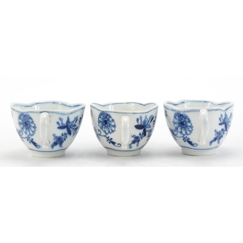 91 - Five Meissen demitasse cups and four saucers, each hand painted in the Blue Onion pattern, crossed s... 