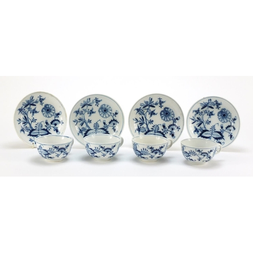 92 - Four Meissen cups and saucers hand painted in the blue onion pattern, crossed sword marks to the bas... 