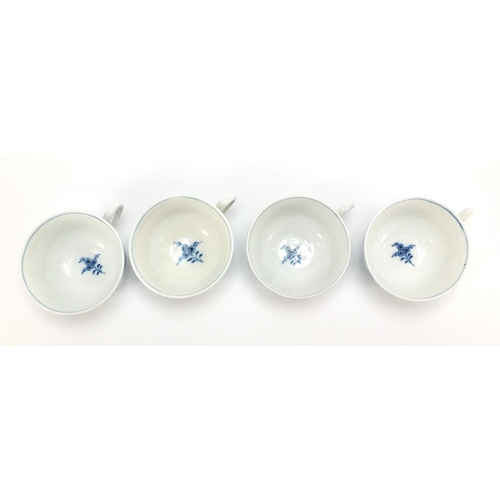 92 - Four Meissen cups and saucers hand painted in the blue onion pattern, crossed sword marks to the bas... 