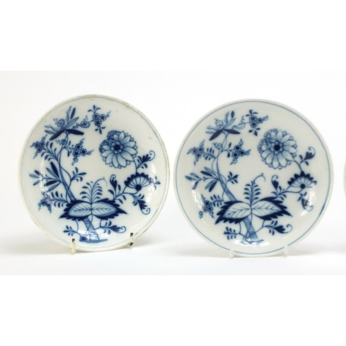 92 - Four Meissen cups and saucers hand painted in the blue onion pattern, crossed sword marks to the bas... 