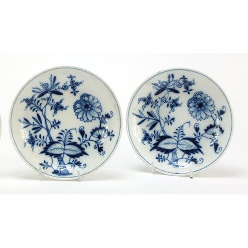 92 - Four Meissen cups and saucers hand painted in the blue onion pattern, crossed sword marks to the bas... 