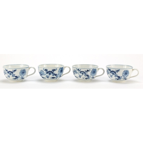 92 - Four Meissen cups and saucers hand painted in the blue onion pattern, crossed sword marks to the bas... 