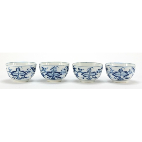 92 - Four Meissen cups and saucers hand painted in the blue onion pattern, crossed sword marks to the bas... 