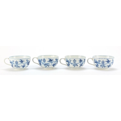 92 - Four Meissen cups and saucers hand painted in the blue onion pattern, crossed sword marks to the bas... 