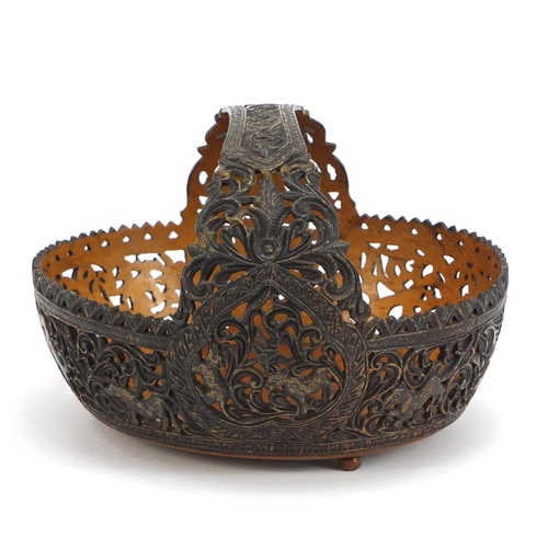 169 - Anglo Indian coconut basket, finely carved with animals amongst flowers and foliage, 18cm wide