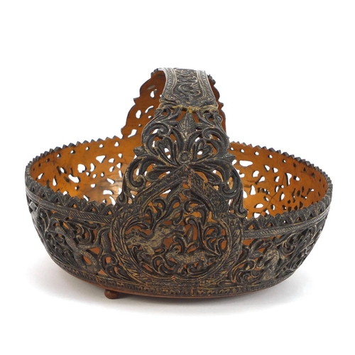 169 - Anglo Indian coconut basket, finely carved with animals amongst flowers and foliage, 18cm wide