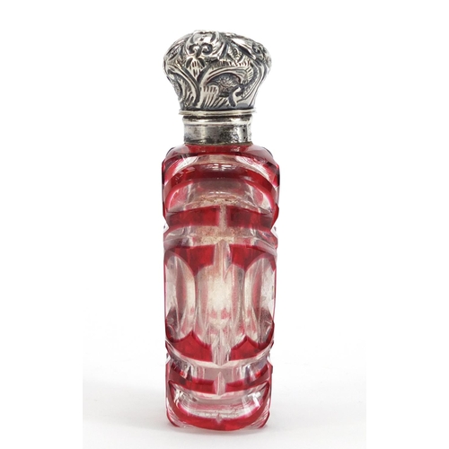 282 - Victorian ruby flashed cut glass scent bottle with unmarked silver hinged lid, 9.5cm high