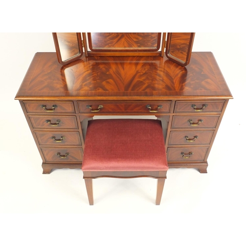 2177 - Mahogany dressing table with footstool and a folding triple aspect mirror, the dressing table 77cm H... 