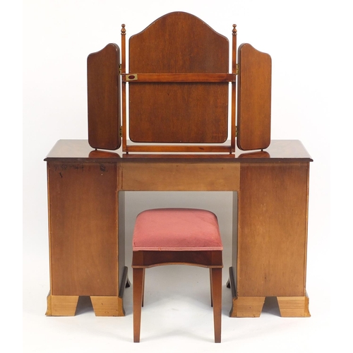 2177 - Mahogany dressing table with footstool and a folding triple aspect mirror, the dressing table 77cm H... 