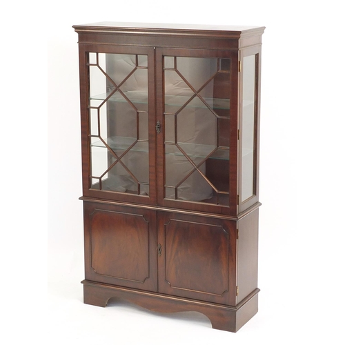 2196 - Mahogany display cabinet fitted with a pair of glazed doors enclosing two glass shelves above a pair... 