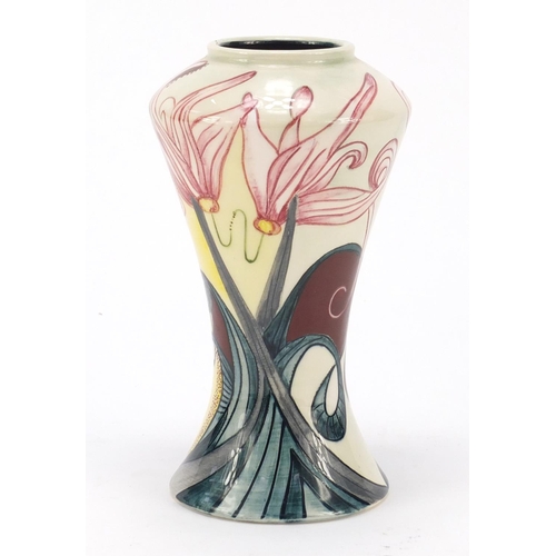 125 - Black Ryden vase hand painted with stylised flowers, impressed marks and painted initials to the bas... 