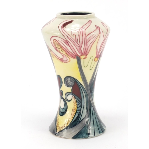 125 - Black Ryden vase hand painted with stylised flowers, impressed marks and painted initials to the bas... 