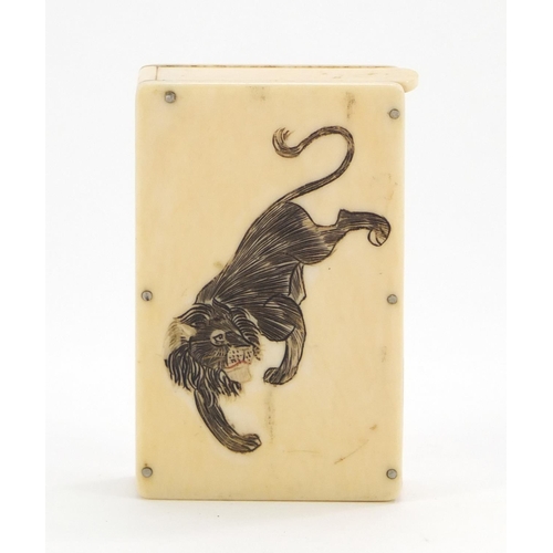 339 - Early 20th century ivory vesta case carved with two Japanese lions, 6.2cm high