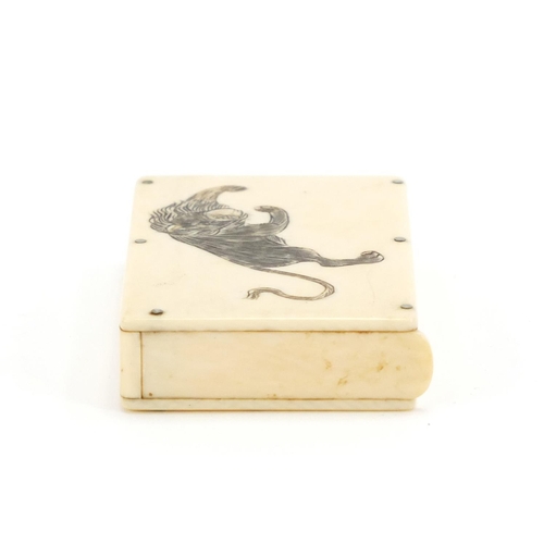 339 - Early 20th century ivory vesta case carved with two Japanese lions, 6.2cm high