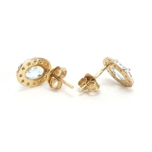 535 - Pair of 9ct gold topaz and diamond earrings, 1cm in length, 1.2g