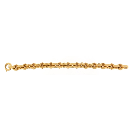 305 - 18ct gold chain link charm bracelet, 21cm in length, 26.5g