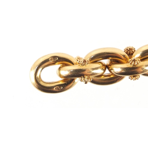 305 - 18ct gold chain link charm bracelet, 21cm in length, 26.5g