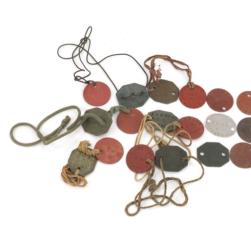 426 - Collection of military interest dog tags, predominantly leather